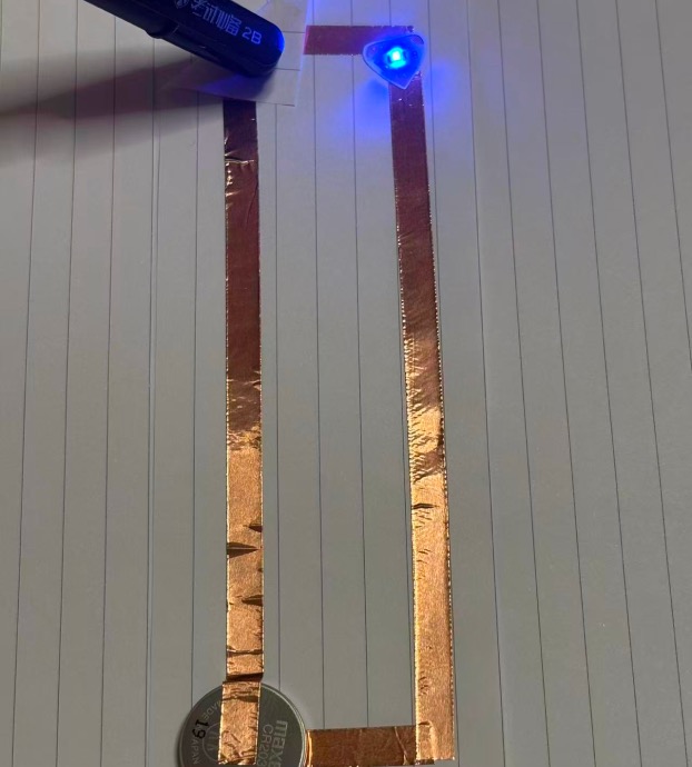 Prototype 3: Constructing an interactive circuit prototype using one LED, connected via battery and copper tape.